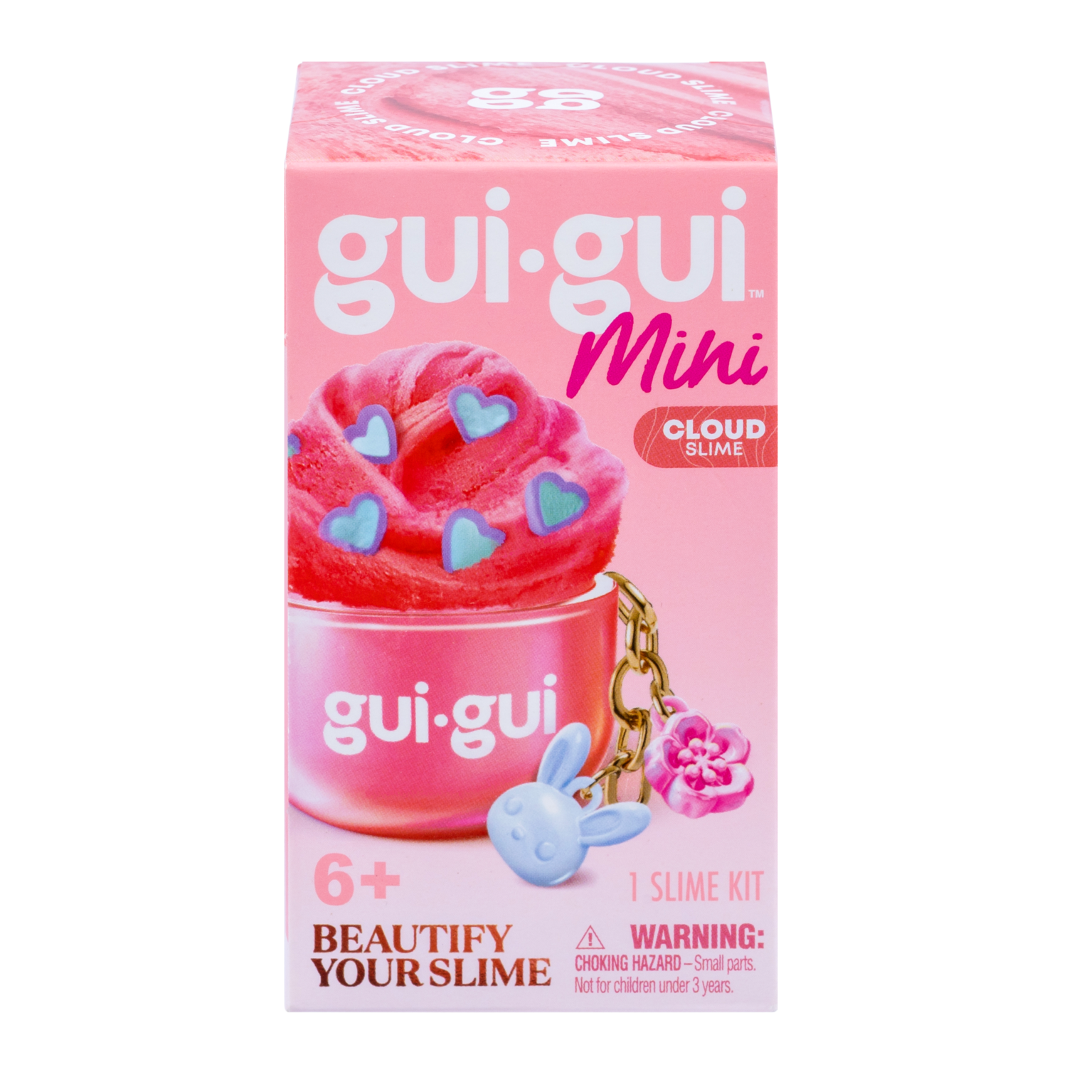 A pink box of Gui Gui Mini Backpack Charm Slime by Moose Toys, showing pink slime with blue heart sprinkles, a blue bunny charm, and a pink flower charm. For ages 6+. Includes warning label for small parts.