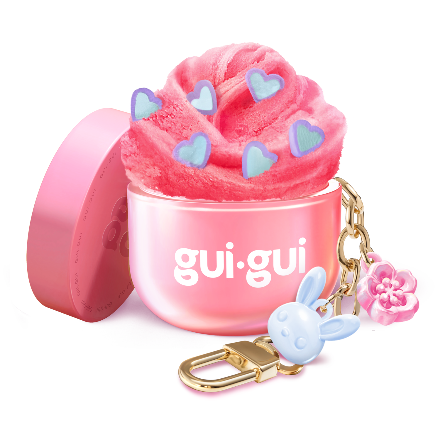 The Gui Gui Mini Backpack Charm Slime by Moose Toys features pink slime with blue heart shapes in a pink gui.gui-labeled container, topped with a gold keychain, blue bunny charm, and pink flower. The lid rests beside it.