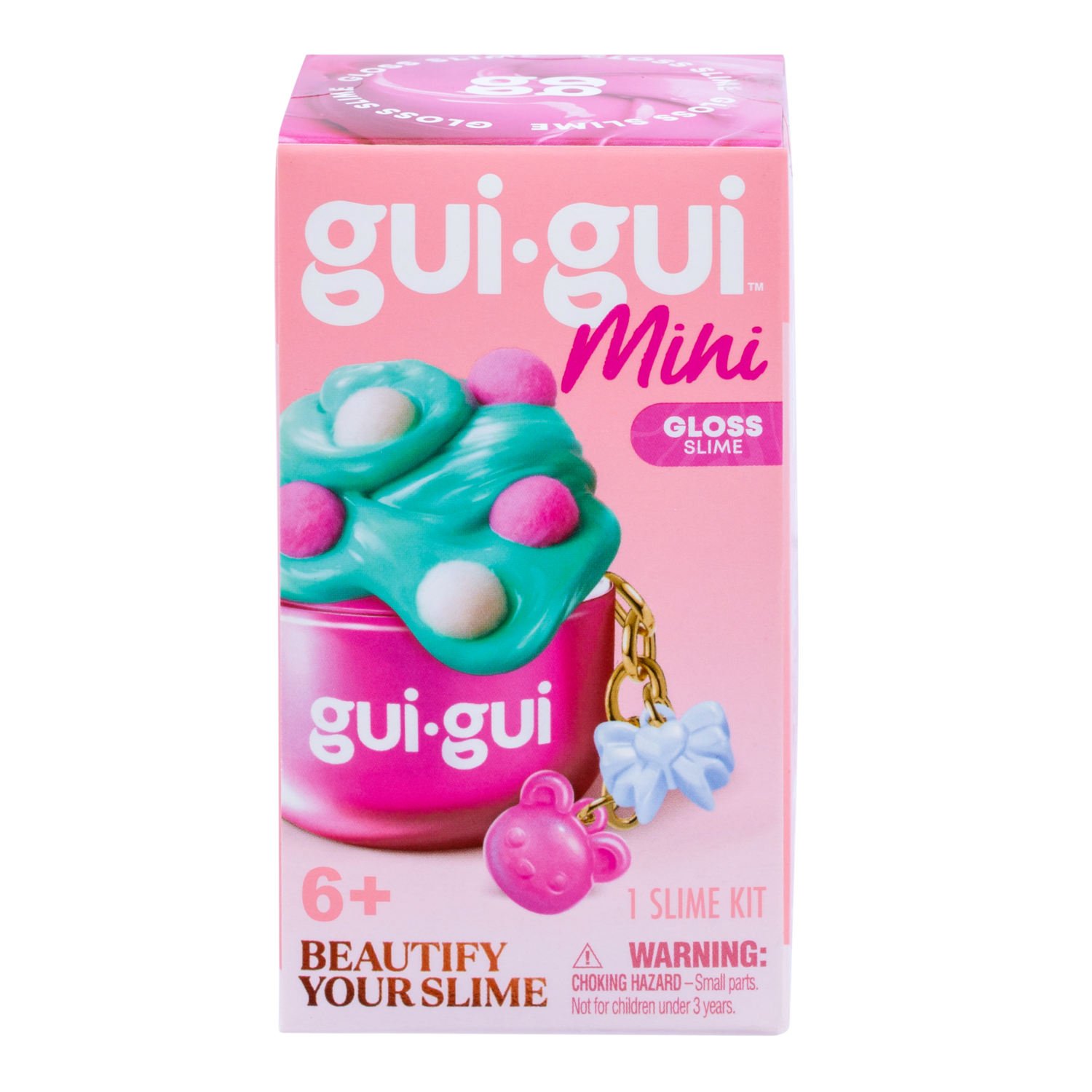 A pink box labeled Gui Gui Mini Backpack Charm Slime by Moose Toys features green and pink slime in a container with a bear keychain. Text includes "Beautify Your Slime," for ages 6+, "1 Slime Kit," and a choking hazard warning.