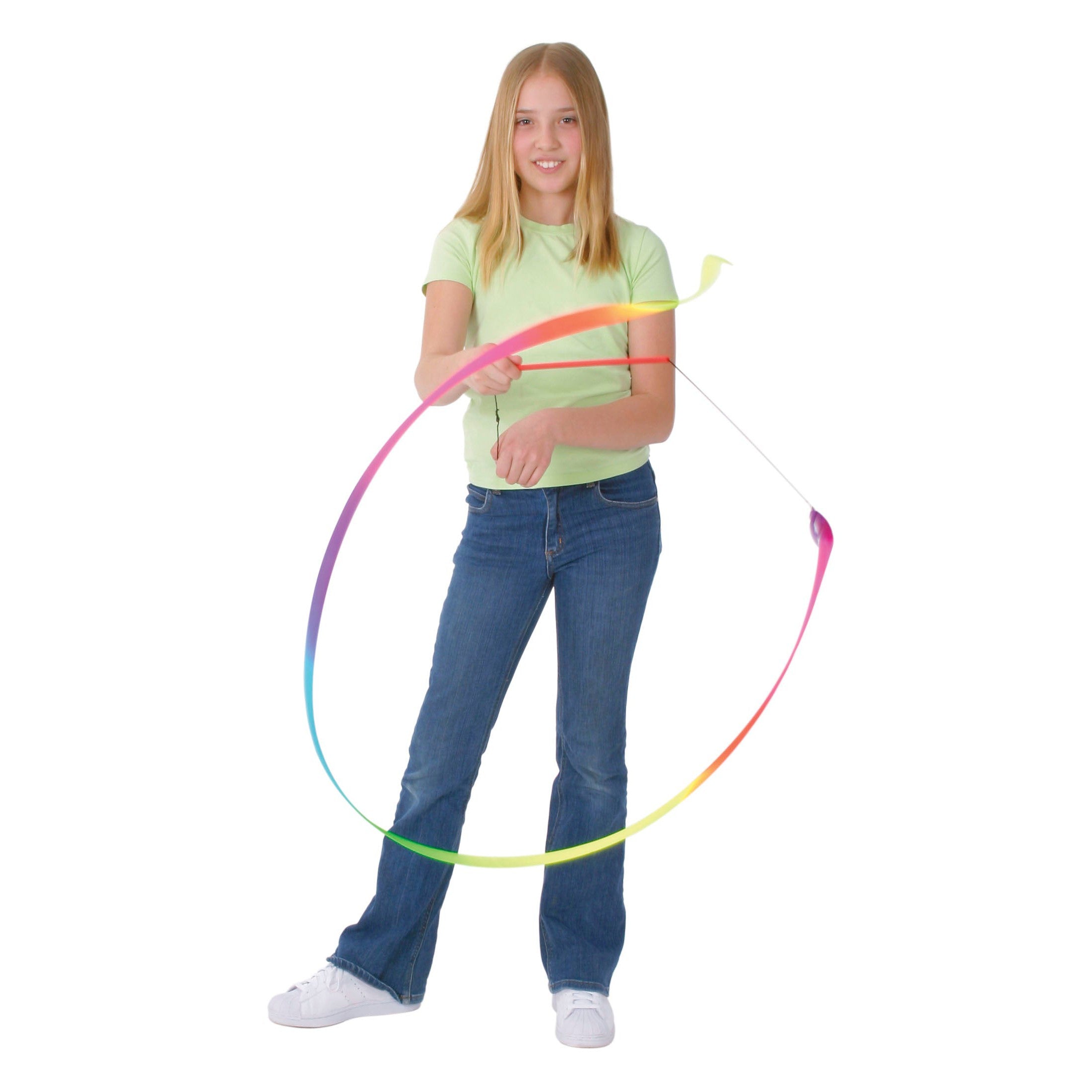 A young girl twirls the colorful YAY! Dance Ribbon, creating a large circle with the vibrant ribbon, against a plain white background.