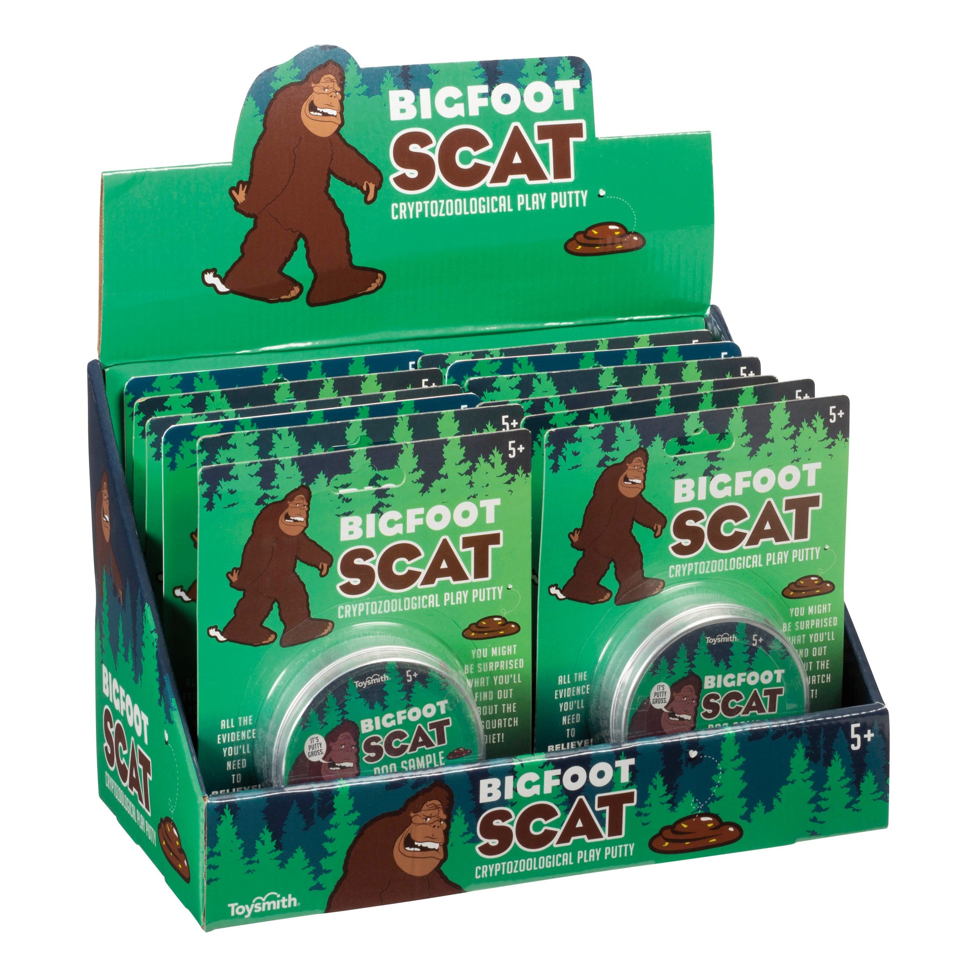 A retail display box contains several packs of Toysmith Bigfoot Scat, a green-packaged play putty with a cartoon Bigfoot and fake poop illustration. This Toysmith product is ideal for ages 5 and up.