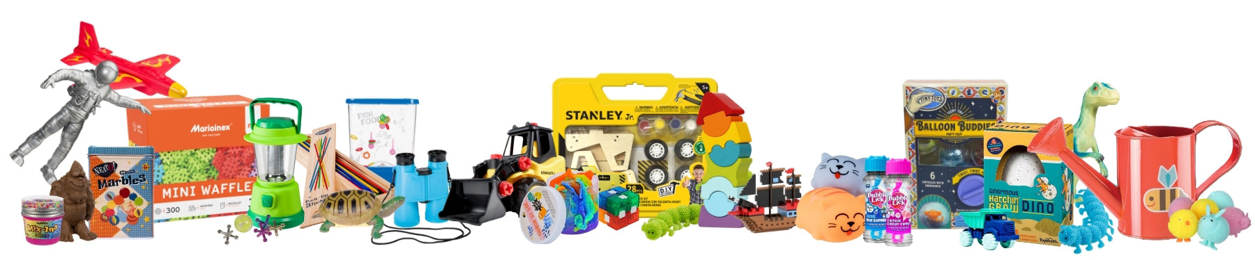 A variety of colorful children’s toys and activity kits, including building blocks, a dinosaur figurine, puzzles, art supplies, a toy truck, fidget toys, an orange mug, and science experiment kits arranged in a row.