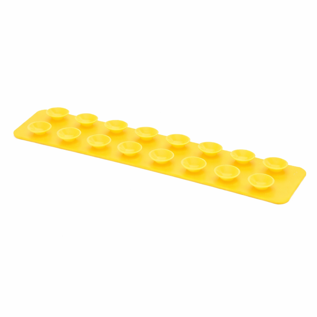 The Sensory Lab Squidgit by Sensory Lab is a yellow rectangular silicone mold featuring 14 round, shallow cavities in two rows, ideal for making DIY sensory or fidget toys that provide satisfying tactile feedback. Shown on a white background.