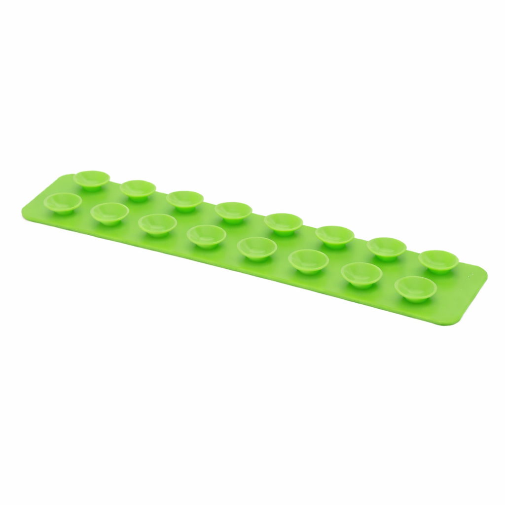 The Sensory Lab Squidgit by Sensory Lab is a green rectangular silicone mat with two rows of raised circular bumps for gripping objects and providing tactile feedback.