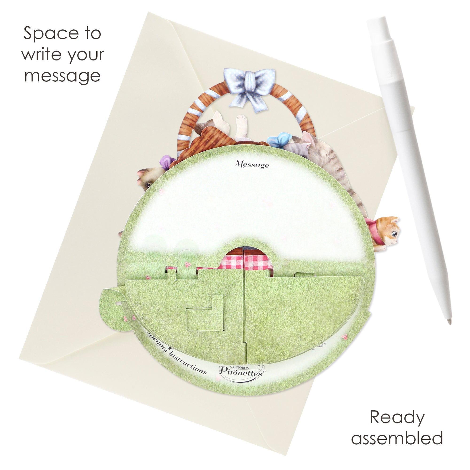 The Santoro Pirouette Card: Kittens in a Basket is a circular, cat-themed greeting card featuring green grass, kitten illustrations, space to write your message, envelopes, and comes ready assembled.