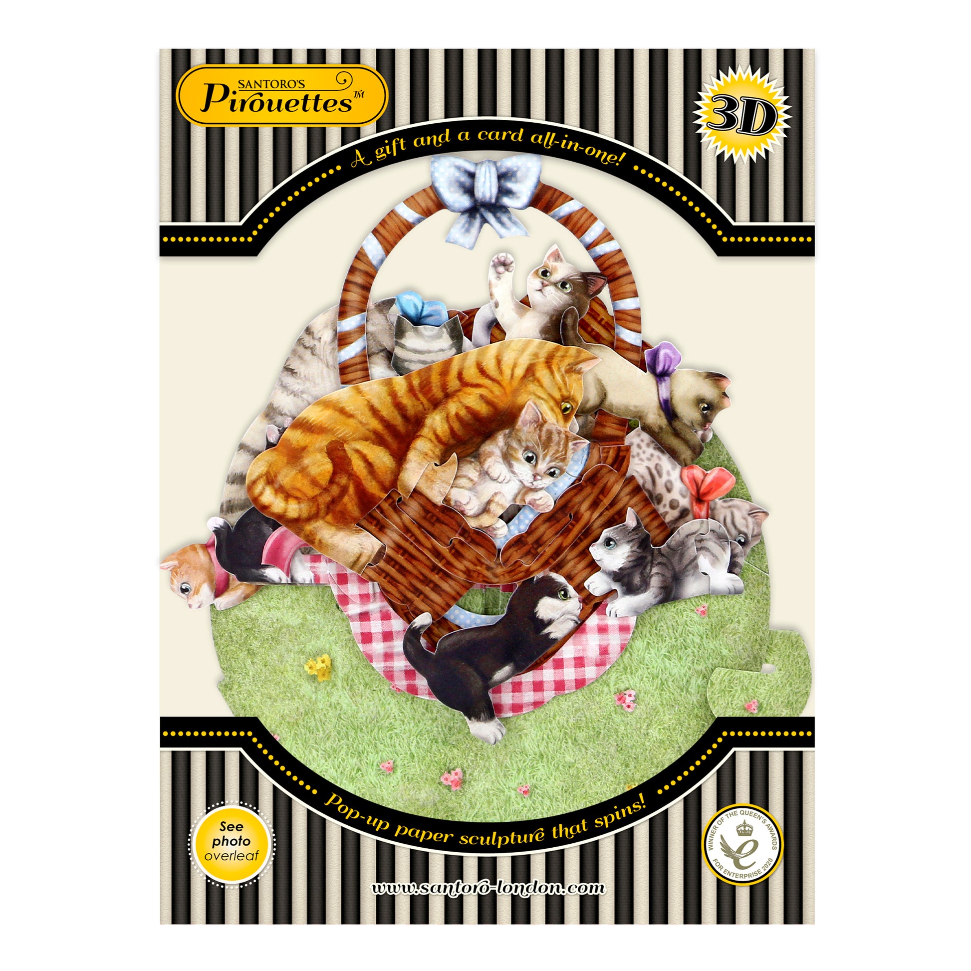 The Santoro Pirouette Card: Kittens in a Basket features a colorful 3D pop-up illustration of playful cats and kittens around a brown wicker basket on green grass, framed by a decorative black and gold border.