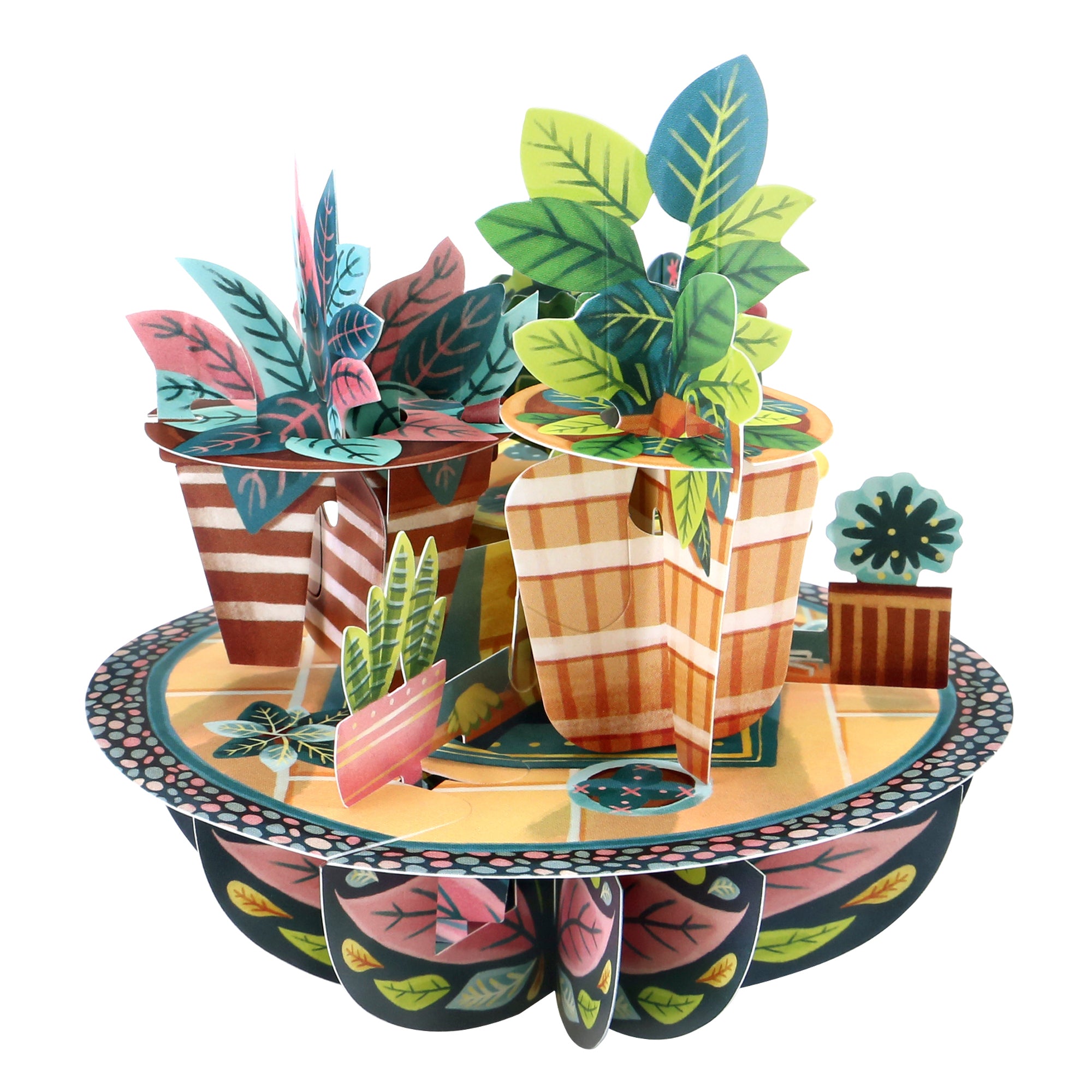 The Santoro Pirouette Card: Potted Plants features a colorful paper sculpture of houseplants with green, pink, and blue leaves in patterned pots on a round decorative base.
