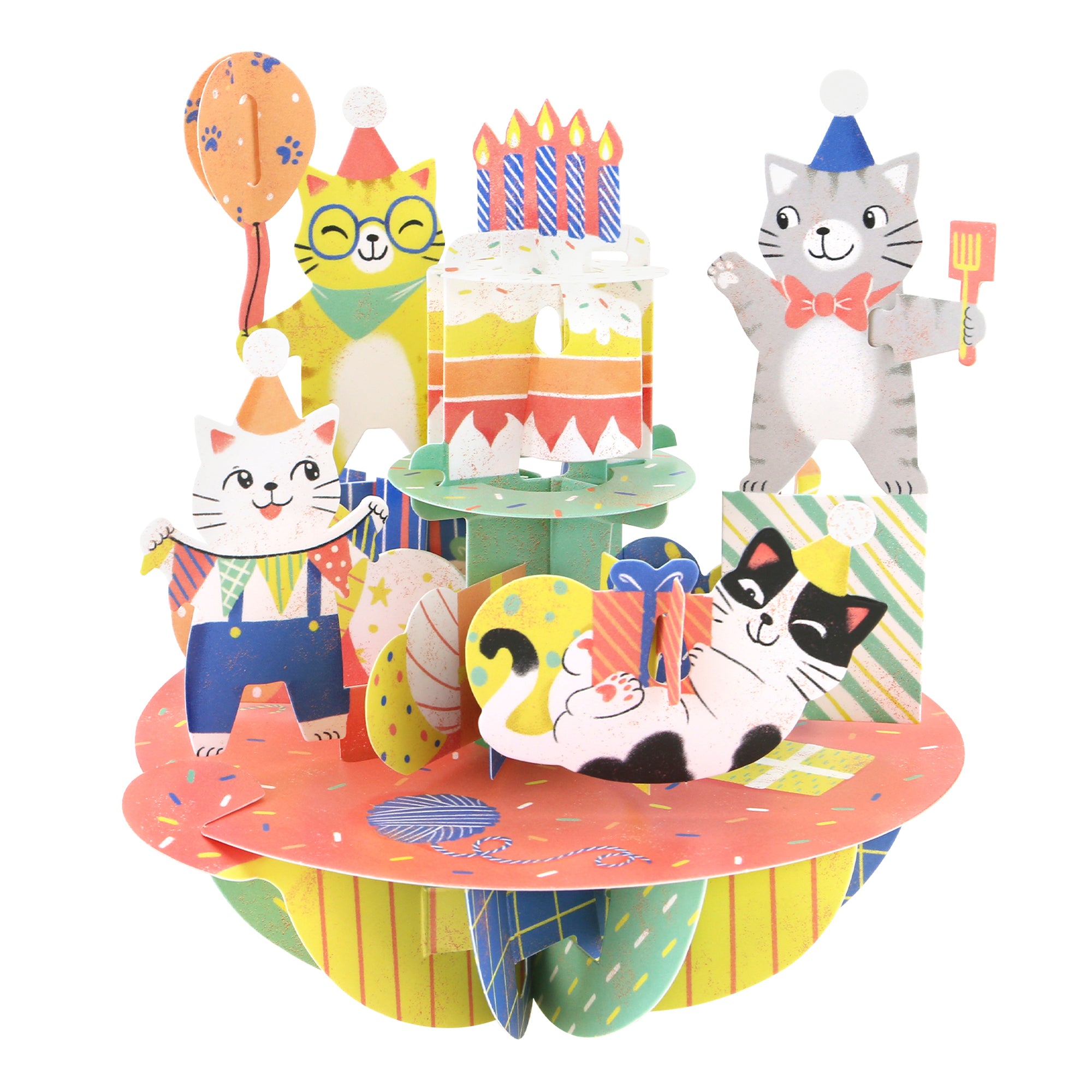 The Santoro Pirouette Card: Birthday Cats is a colorful pop-up card featuring cartoon cats in party hats with balloons, presents, a big cake, and festive decorations. One cat lies down while others stand and celebrate.