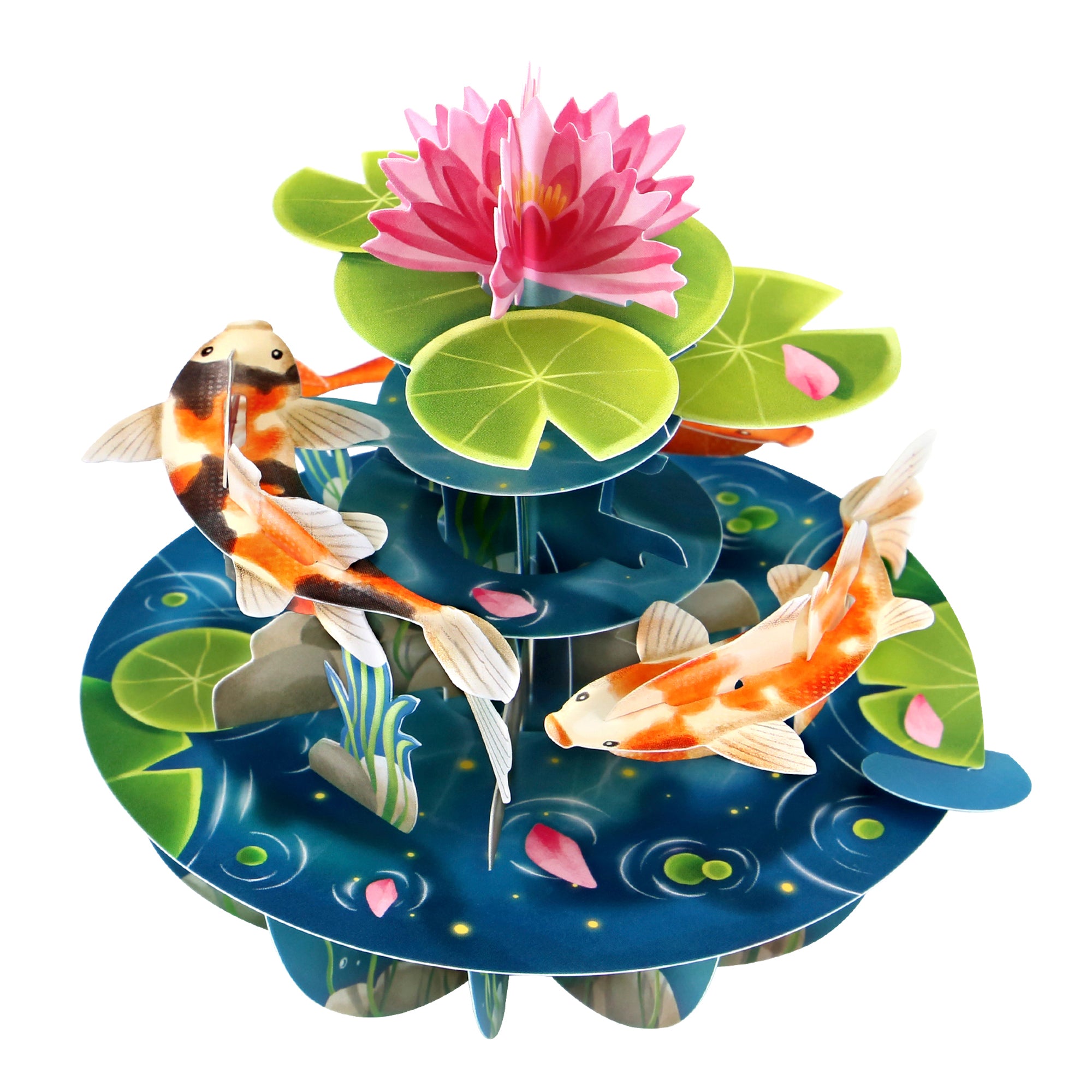 The Santoro Pirouette Card: Koi Carp features a vibrant 3D paper scene with two orange and white koi fish swimming among green lily pads, a pink lotus flower, and floating petals.