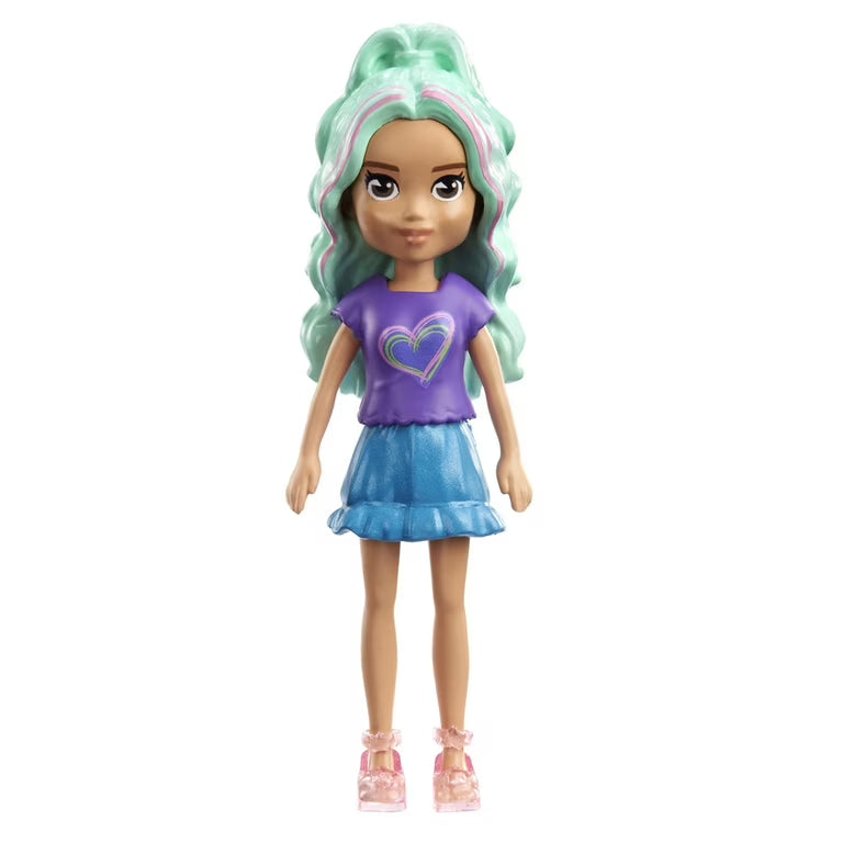 The Mattel Small Polly Pocket Doll features long, wavy mint green hair, a purple shirt with a rainbow heart, blue skirt, and pink shoes. She stands upright against a white background—ideal for inspiring imaginative play.