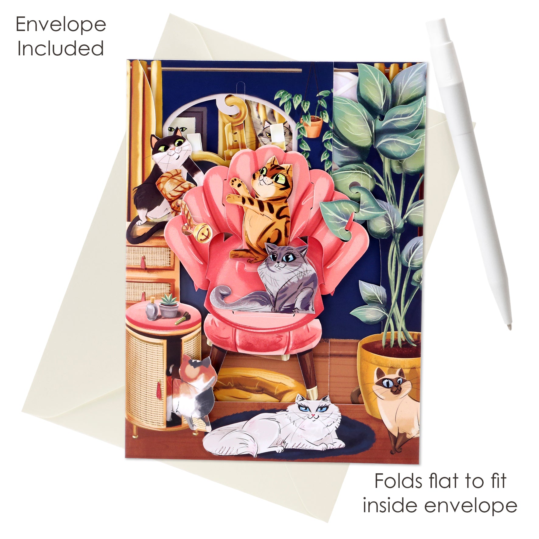 The Santoro Swing Card: Lounging Cats features six illustrated cats in a colorful room around a pink chair with plants. Includes matching envelope and folds flat to fit inside. Shown with a white pen. Text reads, "Envelope Included.
