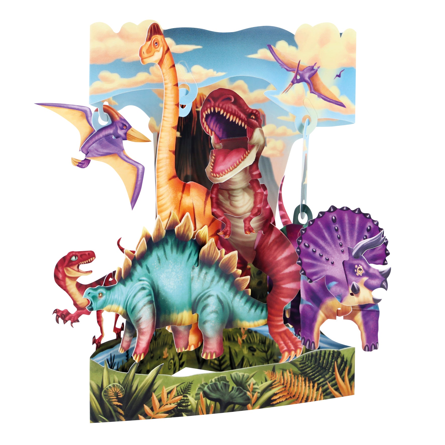 The Santoro Swing Card: Land of the Dinosaurs features a colorful 3D pop-up with T. rex, stegosaurus, triceratops, brachiosaurus, and pterosaurs among lush plants under a bright blue sky with clouds.