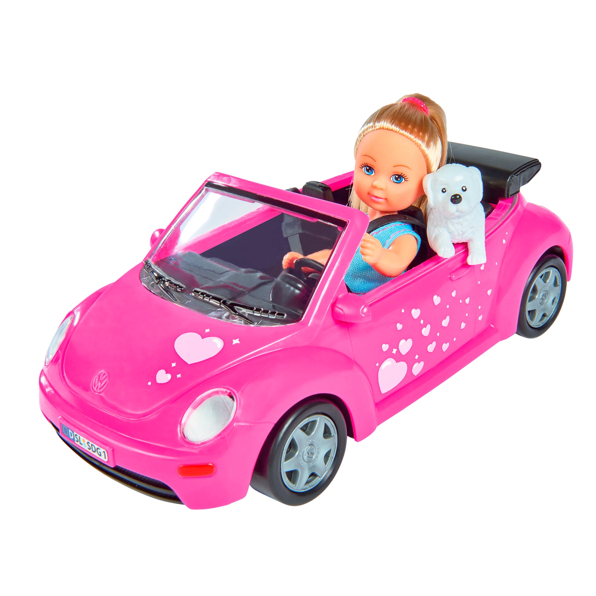 The Simba Dickie EL Evi's Beetle features an Evi doll with blonde hair in a blue top, seated in a pink Beetle convertible decorated with white hearts, plus a small white dog riding in the passenger seat.