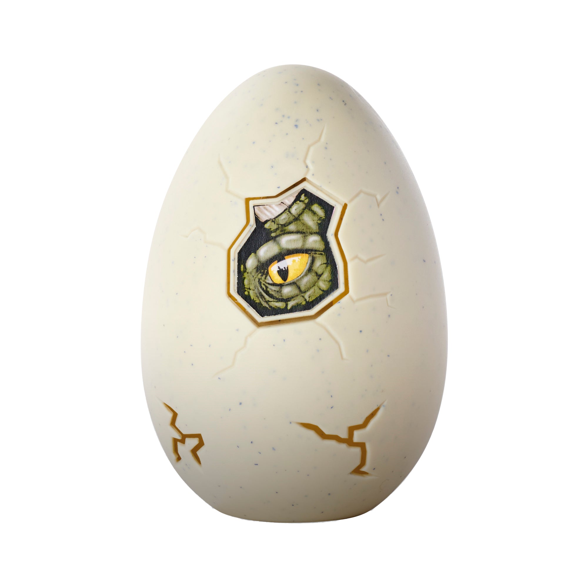 The Simba Dickie Light & Sound Dino Egg Asst features a large cream egg with cracks and a hole, revealing a green reptilian eye. Experience exciting egg hatching with realistic light and sound effects from this dinosaur toy!.