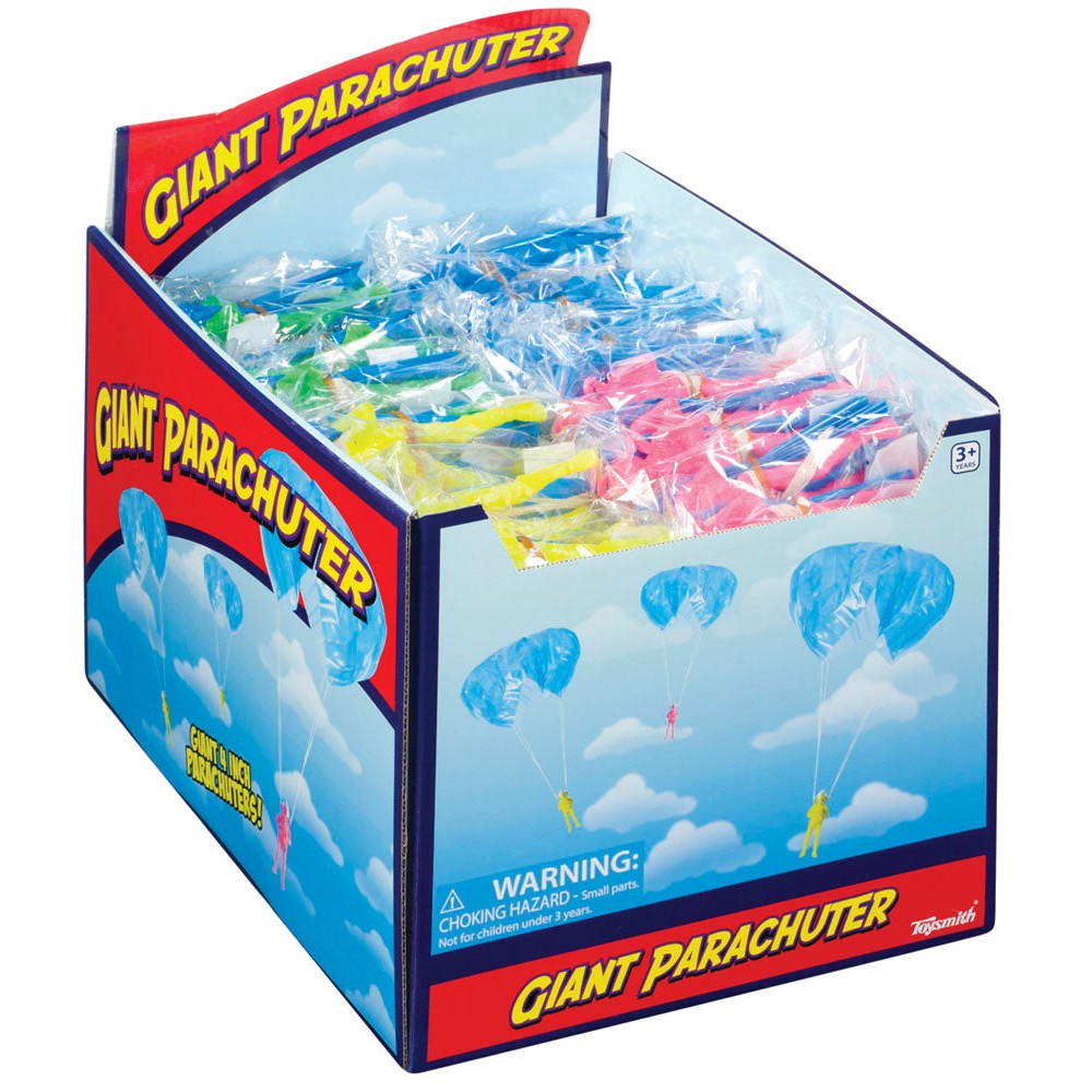 The Toysmith Giant Parachuter display box holds vibrant parachute toys in plastic bags. The Toysmith-branded box shows skydivers against a blue, cloud-filled sky—ideal for outdoor play and adventure.