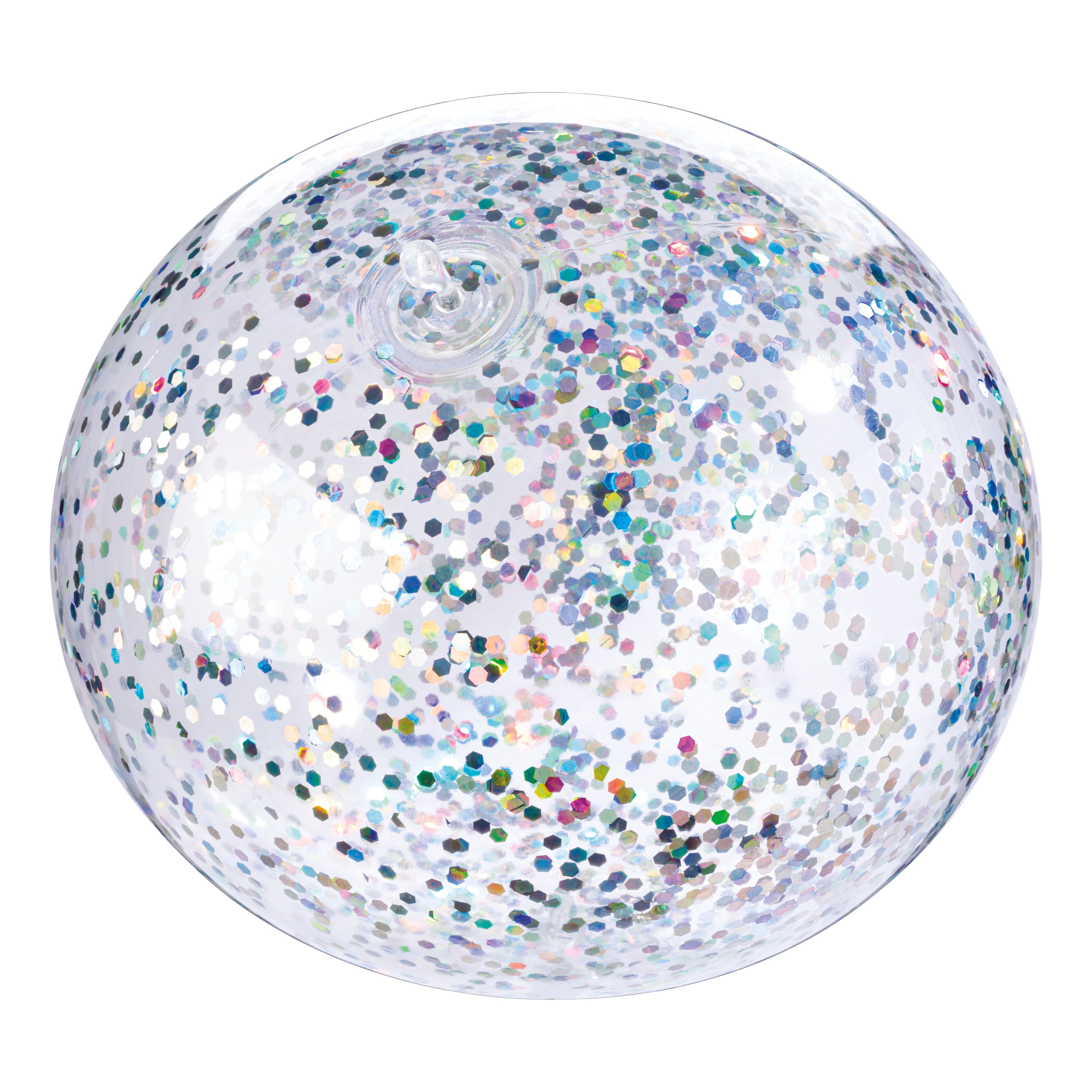 The Toysmith Jumbo Punch Balloon by Toysmith is a clear inflatable beach ball filled with iridescent, multicolored confetti dots, shown from above on a white background.