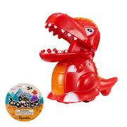 A red plastic Toysmith Dino Press N' Go Zoomers dinosaur toy with an open mouth, orange belly, and wheels below sits beside a round "Dino Zoomsters by Toysmith" tag. Suitable for ages 3 and up.