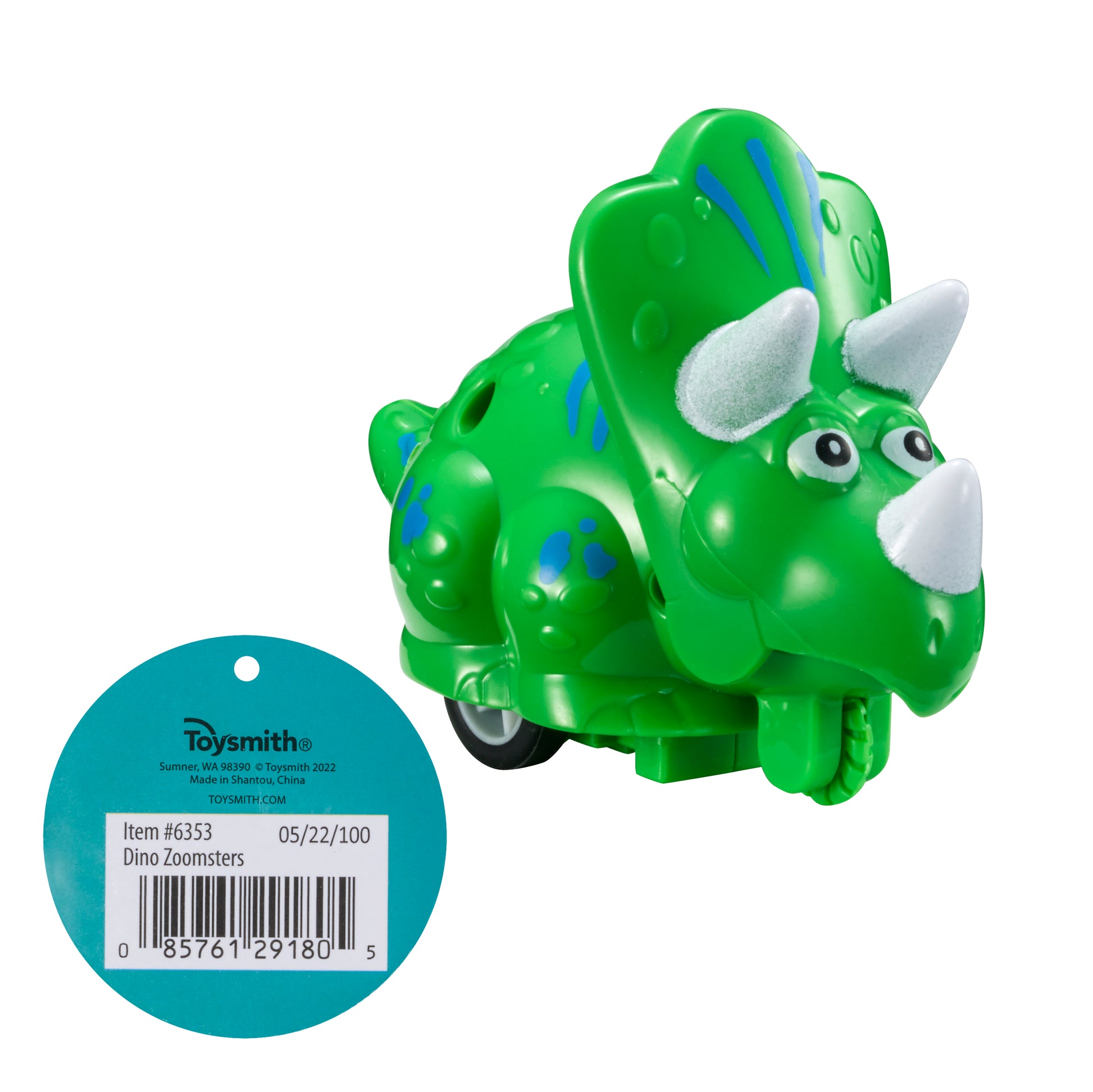 A green Toysmith Dino Press N' Go Zoomers triceratops with blue spots, white horns, and wheels is shown beside a blue circular tag with a barcode and product info.