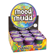 Display box of Mood Mudd Changing Color Dough by Glow-Tec, featuring small purple containers with vibrant rainbow designs. This colorful dough shifts shades by touch, offering psychedelic-themed squishy fun!.