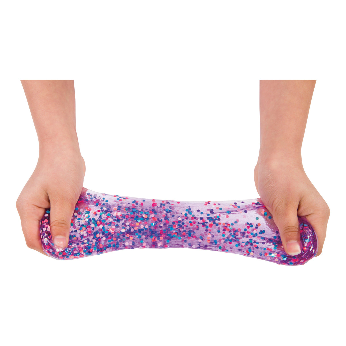 Two hands stretch Toysmith Mix-Ins Slime Asst by Toysmith, a clear purple slime filled with colorful confetti-like mix-ins, against a white background.