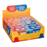 The Toysmith Mars Dirt & Moon Dust display box holds small red and blue sensory dough containers for ages 5+, featuring space-themed graphics and "Astronomically Fun!" text. Brand: Toysmith.