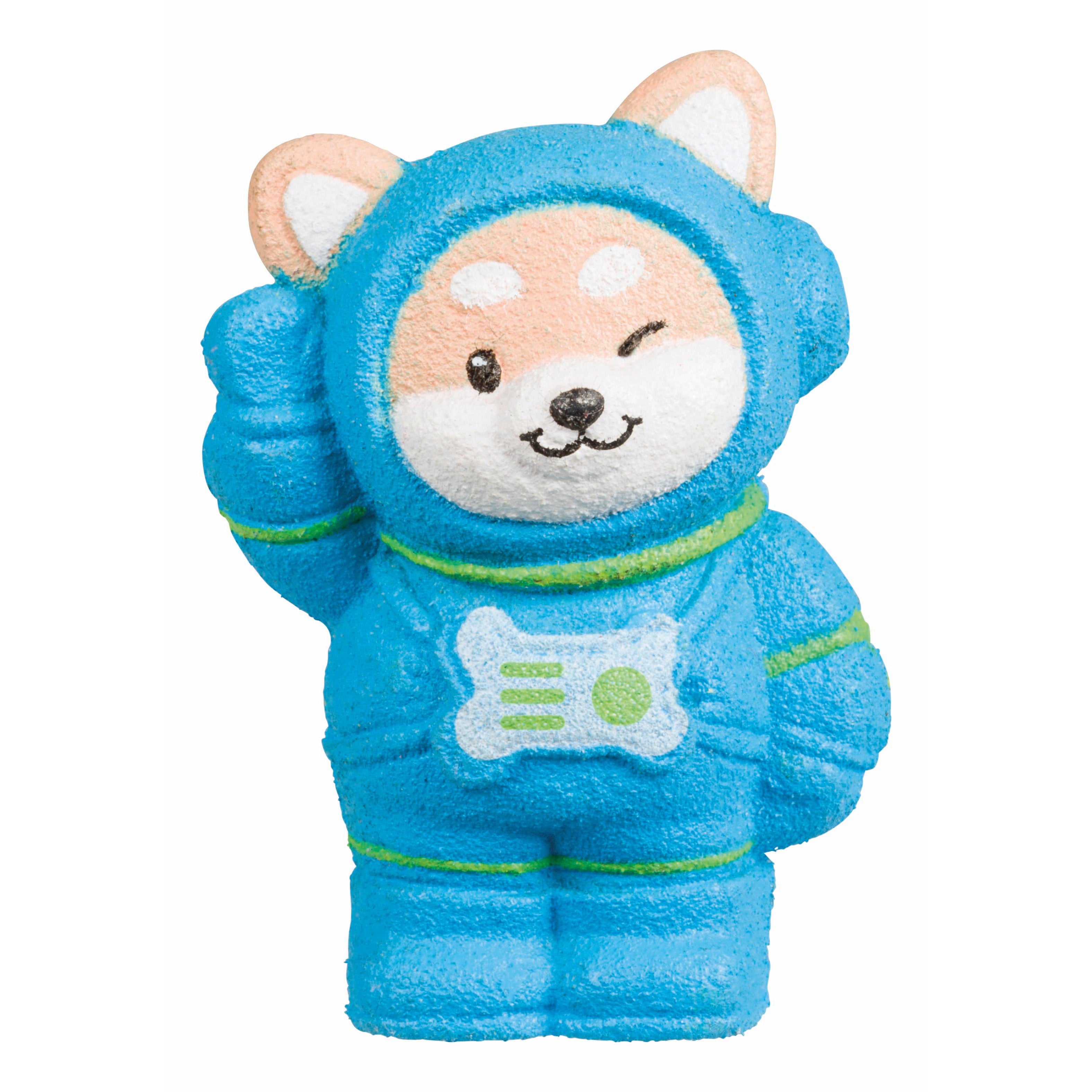 A cute cartoon dog from the Toysmith Astro Grow Pets line by Toysmith wears a blue astronaut suit, winks, and playfully salutes with a raised paw.