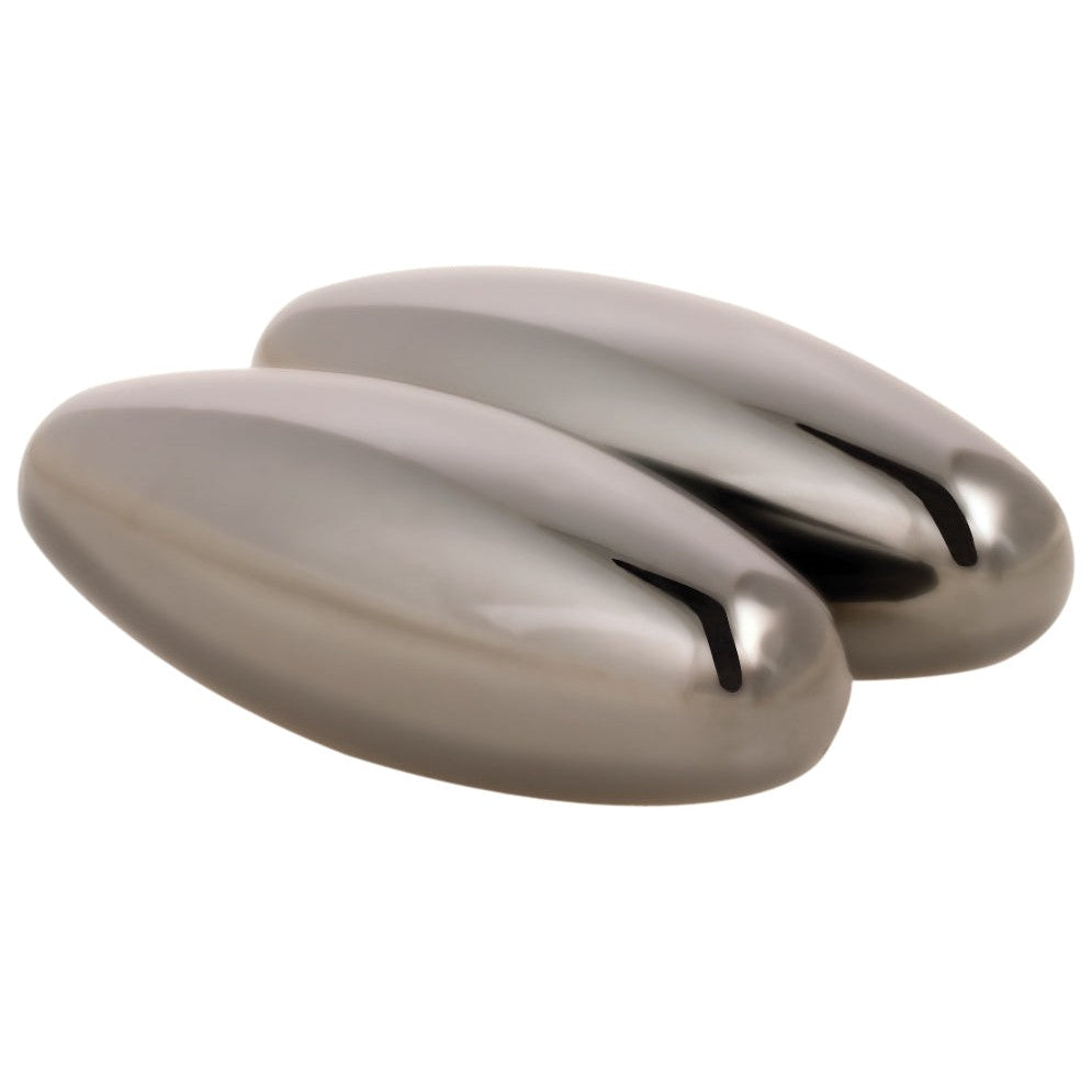 Two shiny, oval-shaped Toy Science Magna Buzz hematite magnets from Toy Science are placed side by side on a white background. Their reflective surfaces make them an intriguing STEM toy for science enthusiasts.