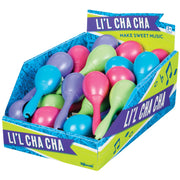 A Toysmith Li'l Cha Cha box contains colorful plastic maracas in blue, pink, green, and purple for kids ages 3+. Decorated with musical notes and playful designs, they're perfect party favors with a Toysmith Cosmic Ray Light-Up Wand.