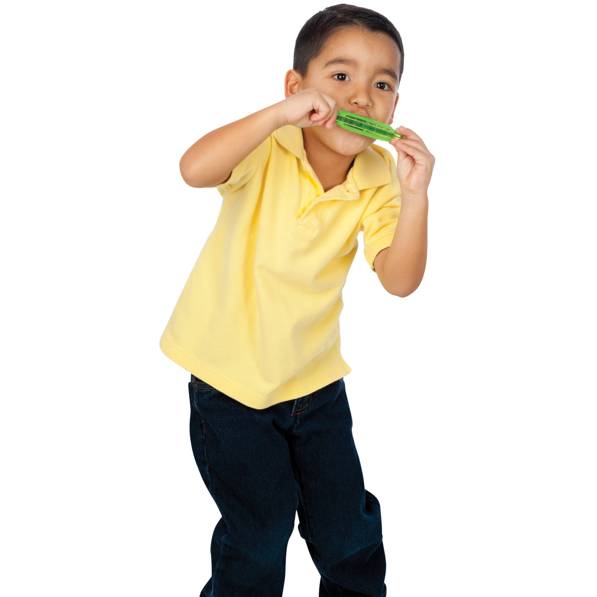 A young boy in a yellow shirt and dark jeans plays the Toysmith Translucent Harmonica by Toysmith, looking engaged with the beginner musical toy against a white background.
