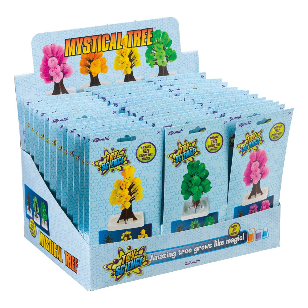 Display box of Toy Science Mystical Tree kits by Toy Science, featuring packets with colorful crystal trees—orange, yellow, green, and pink—on stands and the phrase "Amazing tree grows like magic!" on the packaging.