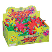 The Toysmith Atom Ball display box contains colorful, spiky rubber balls in green, pink, yellow, and red. Decorated with cartoon atom designs and labeled "Atom Ball," this Toysmith fidget toy offers endless sensory fun.
