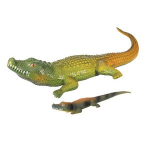 Two Toysmith Ginormous Grow Crocodiles, one large and one small, with green bodies and yellow-orange tails, are positioned side by side on a white background for a realistic crocodile appearance.