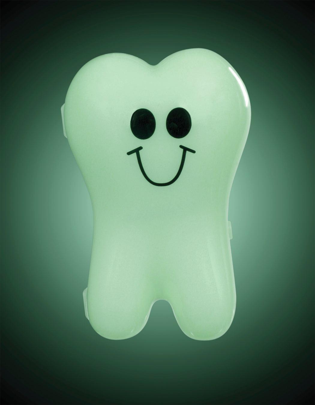 The Toysmith Twinkle Toof by Toysmith is a light green, cartoonish tooth-shaped glow-in-the-dark keeper with a smiling face and black eyes, shown against a dark gradient background.