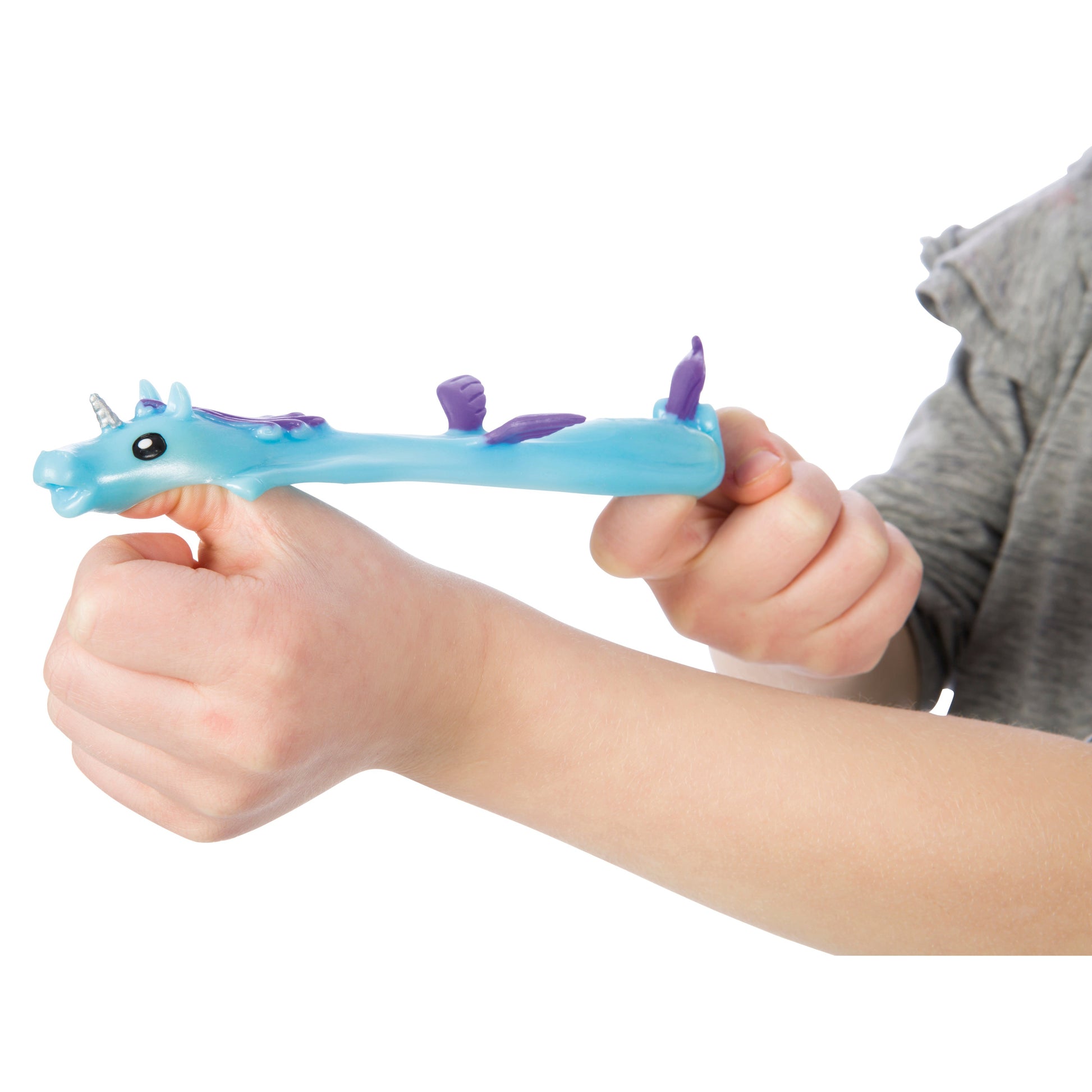A child wears a blue and purple unicorn slap bracelet, ideal for kids who love playful accessories like finger toys and Toysmith Unicorn Flingers by Toysmith.