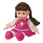 The My Sweet Baby 12in Soft Doll by My Sweet Baby has long brown pigtails, a pink flower dress over a plaid shirt, and pink shoes—perfect for pretend play with its soft body and seated pose.