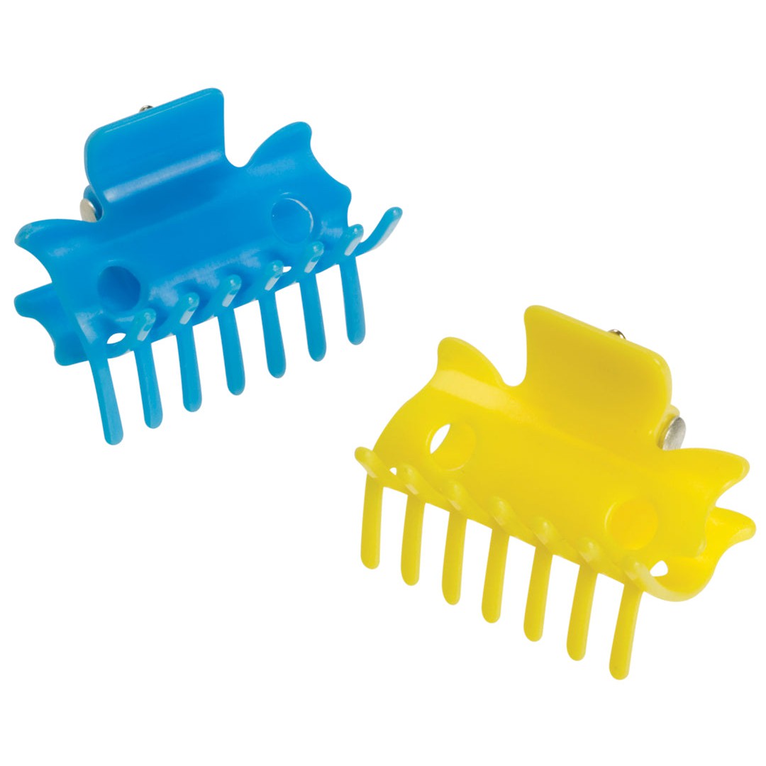 Two plastic fish-shaped hair claws, one blue and one yellow, with metal springs and wide teeth, make fun styling accessories. Perfect for adding flair to any Farm Fresh Horse Family Set by Toysmith. Placed on a white background.